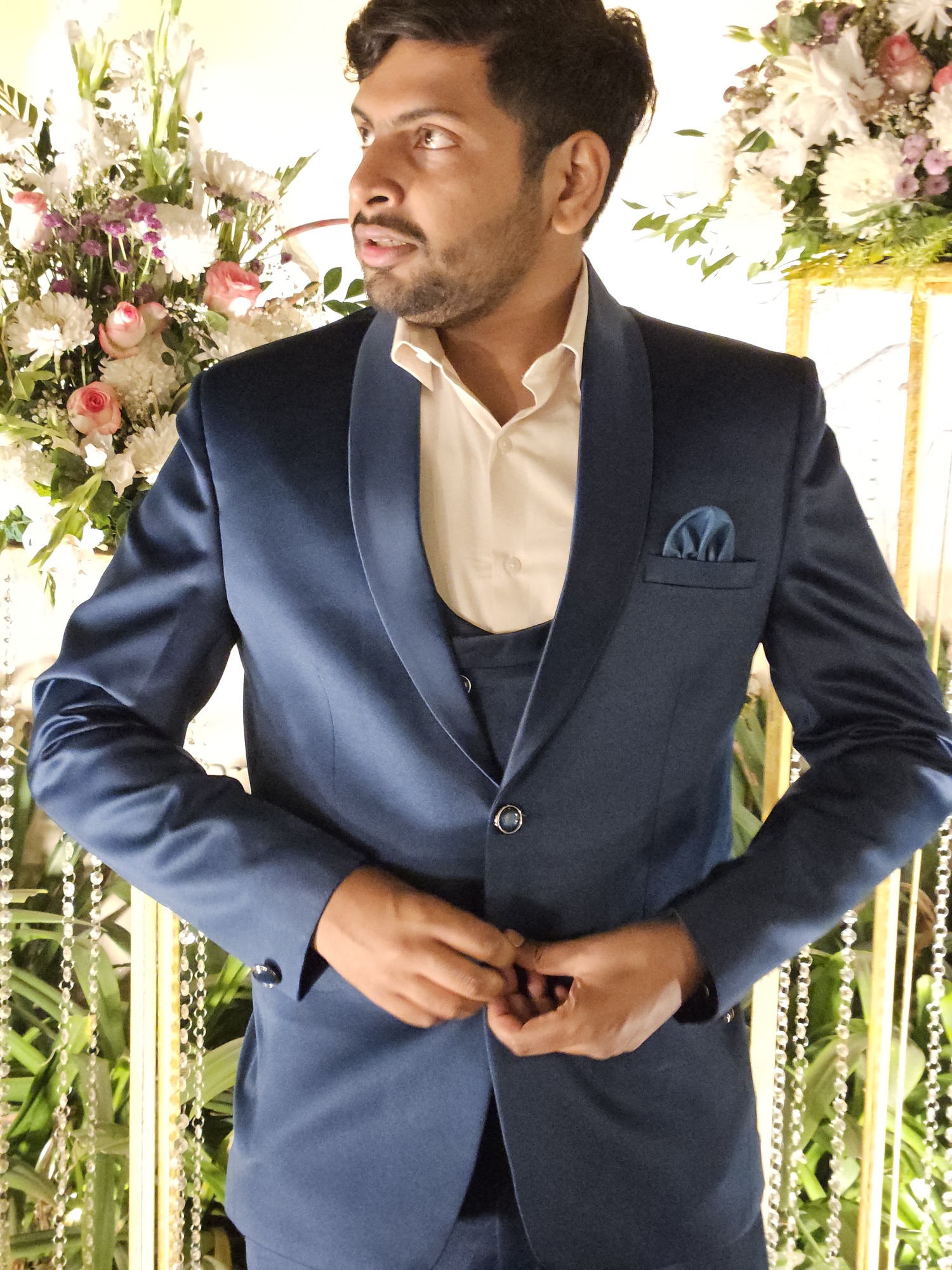 Ankit dressed formally in a blue suit