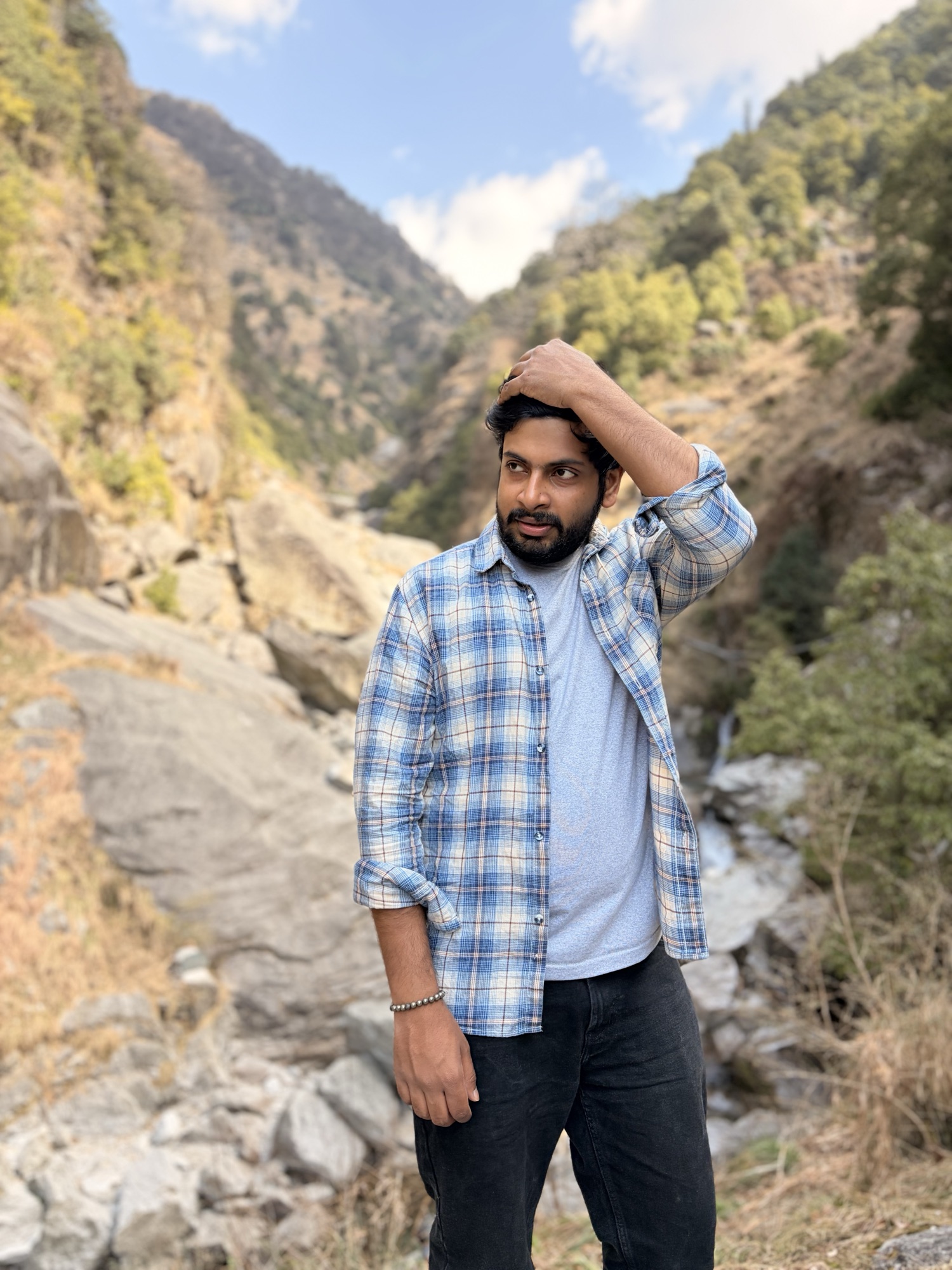 Ankit smiling during a mountain trip