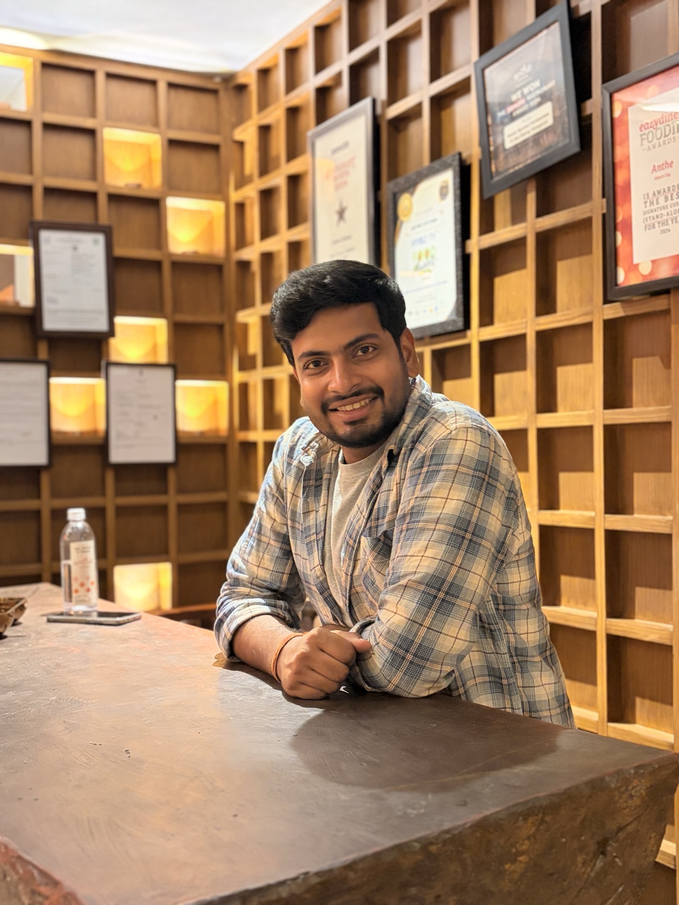 Ankit smiling during a relaxed evening out