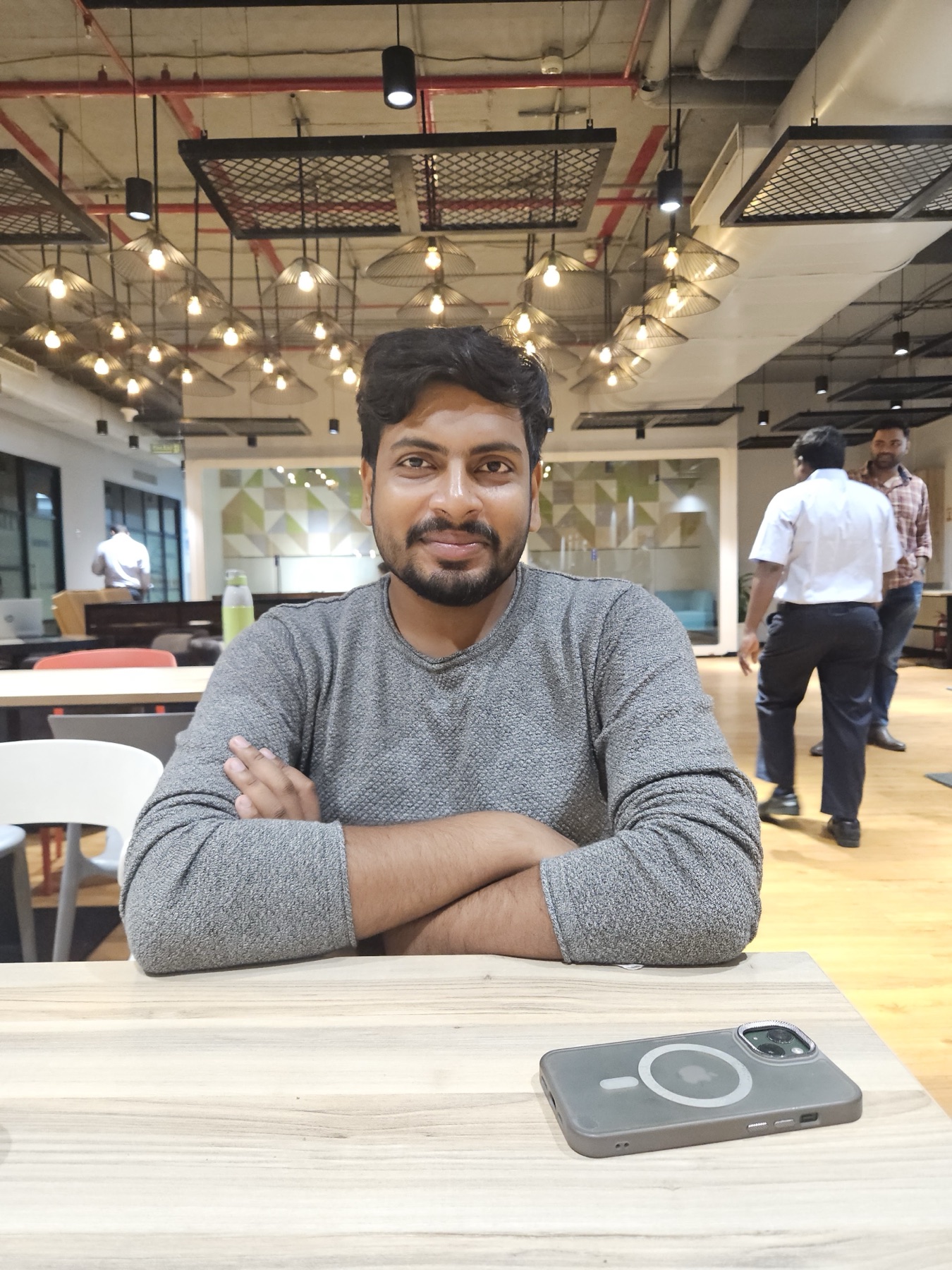 Ankit smiling during a relaxed moment at work